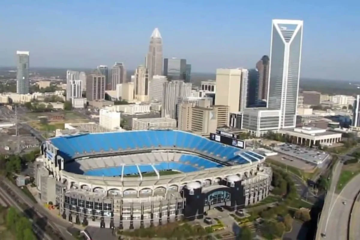 This image captures the energetic Charlotte skyline, featuring the iconic Bank of America Stadium and high-rise buildings. The urban landscape highlights the city's vibrant atmosphere, perfect for nightlife, entertainment, and group exploration.